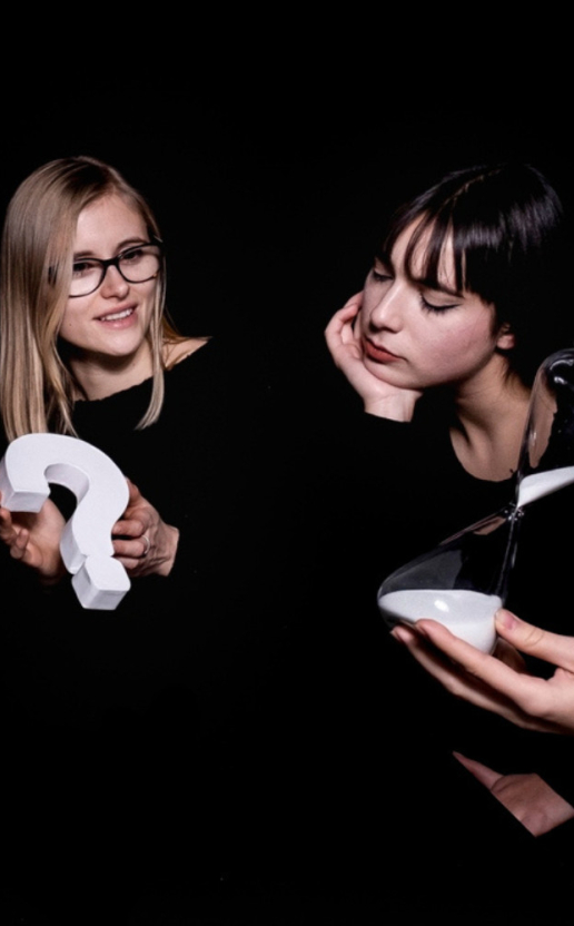 Group of people solving puzzles in the dark during an immersive escape game.