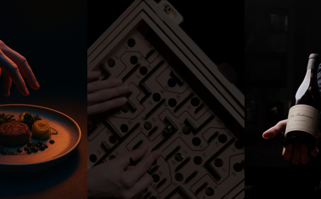 Assiette gastronomique, jeu d’escape et bouteille de vin dans une ambiance sombre pour illustrer les événements immersifs Dans le Noir ?